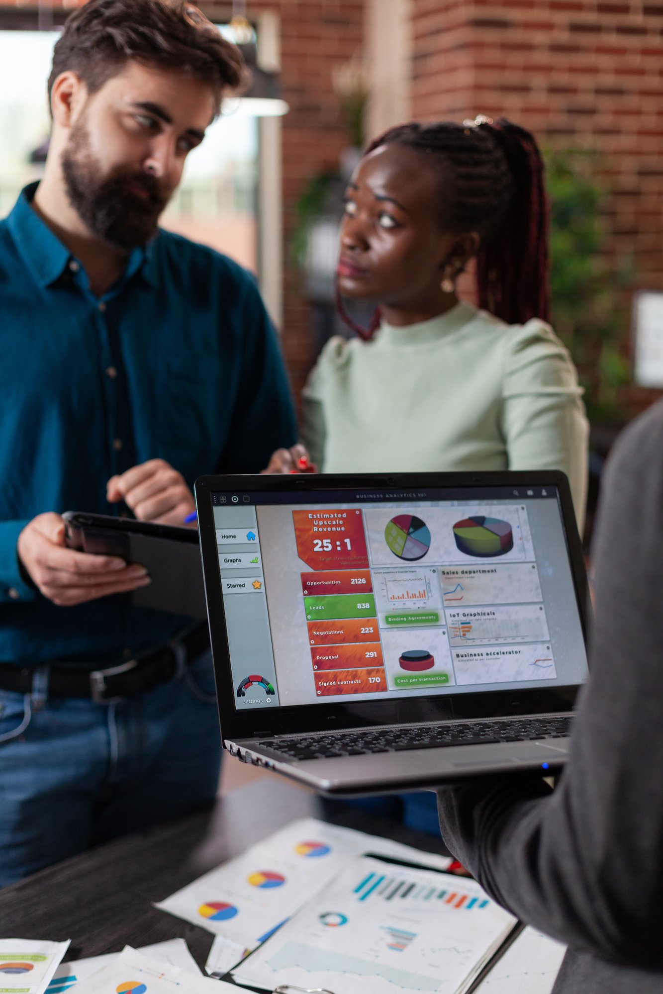 multiracial-businesspeople-analysing-company-turno-2025-02-19-15-42-51-utc